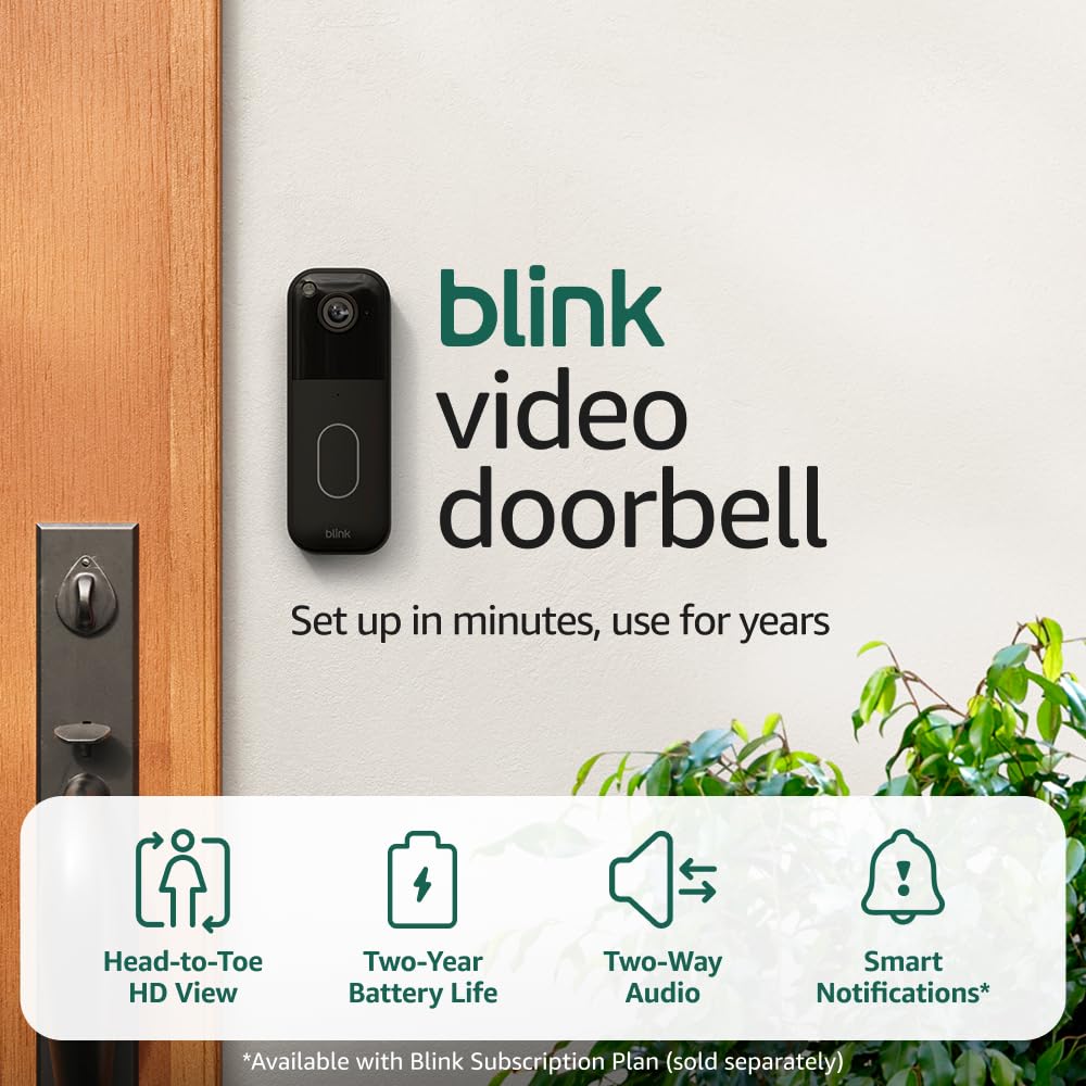 blink outdoor security cameras installed on a front porch and driveway at sunset
