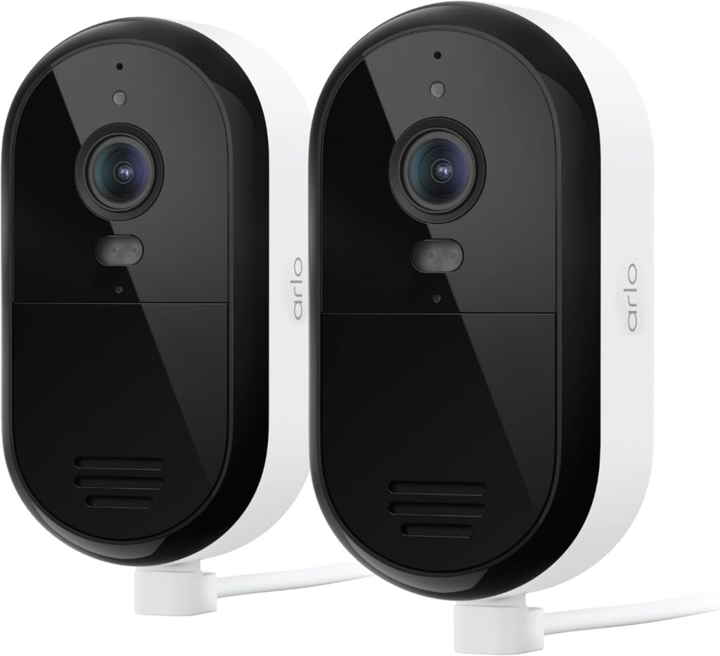 arlo outdoor security cameras mounted on a modern home garage at dusk
