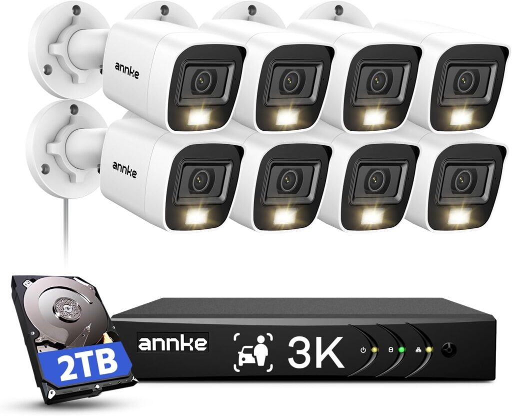 Installer connecting PoE cables on wired security camera system NVR setup in home office

